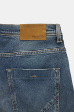 Incotex Jeans smoky blue shown from the back waist up, made of elastic cotton with slightly grippy texture, authentic wash, slim fit, slightly tapered, five-pocket style, button fly, and leather patch.