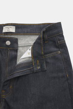 Close-up front view of Percival Jeans 'Straight Leg' dark blue, showing zip fly, five-pocket style, pure cotton denim with typical material structure, grippy quality, tapered fit, regular thigh width, ankle length, and straight cut.