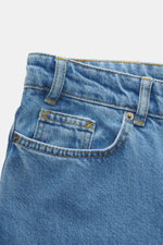 Close-up front view of Percival Light Blue Jeans showing denim made from pure cotton with typical material texture, grippy quality, tapered fit, regular thigh width, ankle length, straight cut, zip fly, and five-pocket style.
