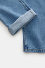 Close-up image from a top-down perspective of Percival Light Blue Jeans showing denim made from pure cotton with typical material texture and grippy quality, featuring a tapered fit, regular thigh width, ankle length, straight cut, zip fly, and five-pocke