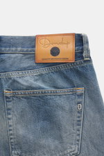 Close-up rear view of Dondup Jeans 'Icon Relax' smokey blue showing the leather patch with logo on waistband, five-pocket style, selvedge denim made of pure cotton, slightly textured feel, authentic used wash, modern distressed effects, Icon Relax Fit (Ta