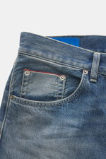 Close-up front view of Dondup Jeans 'Icon Relax' smokey blue showing selvedge denim made of pure cotton, slightly textured feel, authentic used wash, modern distressed effects, Icon Relax Fit (corresponds to Tapered Fit), regular thigh width, ankle length