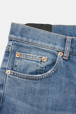 Close-up front view of Dondup Jeans 'Bray' smoky blue in denim made of elastic cotton with soft feel, authentic wash, regular fit, button fly, five-pocket style, and small metal initial.