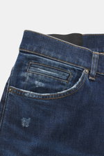 Close-up back view of Dondup Jeans 'George' dark blue, showing authentic wash, stretch cotton denim, skinny fit, button fly, five-pocket style, welted coin pocket, back pockets with stitching, typical metal initial, and internal woven label, with soft tou
