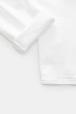 Close-up top-down view of the cuff and fabric texture of Dondup Jeans 'Icon Relax' offwhite, made of denim cotton, slightly elastic quality, slightly textured feel, Icon Relax Fit (equivalent to Tapered Fit), regular thigh width, ankle-length, button fly,