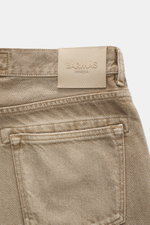Close-up rear view of Barmas Venezia Jeans 'Denver' light brown showing leather patch, five-pocket style, denim made from pure cotton with slightly grippy texture, regular fit, tapered, and button fly.