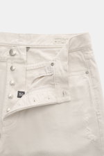 White Brunello Cucinelli Jeans 'Iconic Fit' navy shown from a close-up front view with button fly open, five-pocket style, leather patch, logo stitching on coin and back pockets, made of pure cotton denim, grippy quality, regular thigh width, very slim ta