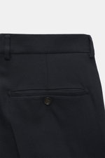 Windsor Trousers 'Silvi' dark navy melange shown from rear close-up, featuring back button pocket, belt loops, soft wool-cashmere blend, slim fit.