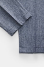 Close-up top-down view of Windsor Trousers 'Silvi' smoky blue melange fabric and hem, showing wool-cashmere blend texture.

<p>The label WINDSOR has created the epitome of stylish men’s trousers with classic details with the model 'Silvi' in a wool-cashme