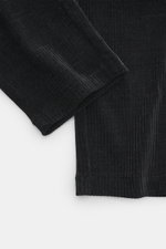 Close-up top-down view of Emporio Armani Cord jogpants black showing high-quality microfiber fabric with soft touch, tapered fit, elastic waistband with button, and piped welt and back pockets.