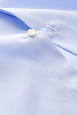 Close-up front view of Borrelli Business Shirt 'Luciano' Shark Collar light blue showing mother-of-pearl button, twill cotton fabric, and fine stitching.