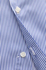 Close-up front view of the Borrelli Business Shirt 'Luciano' Shark Collar navy/white striped showing fine twill cotton fabric, mother-of-pearl button, and precise stitching, highlighting masterful craftsmanship with a timeless striped pattern, slim fit, F