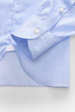 Borrelli Business Shirt 'Luciano' Shark Collar blue/white striped shown from above, featuring slim fit twill cotton, French button placket with mother-of-pearl buttons, classic sport cuff, back waist darts, and rounded hemline, embodying masterful Neapoli