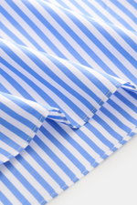 Close-up view of blue and white striped fabric of the Borrelli Business Shirt 'Luciano' Shark Collar blue/white striped, showcasing fine cotton twill, smooth texture, and precise stitching with handcrafted details. Masterful craftsmanship down to the smal