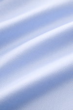Close-up of the fine cotton weave of the Borrelli Business Shirt 'Nando' Shark Collar Light Blue, showcasing its soft, smooth texture and craftsmanship from a macro perspective.