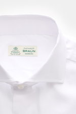 Close-up front view of Borrelli Business Shirt 'Nando' Shark Collar white, showcasing pure cotton, soft touch, fine weave, slim fit, French button placket with mother-of-pearl buttons, classic sport cuff, rounded hemline, and masterful Neapolitan tailorin