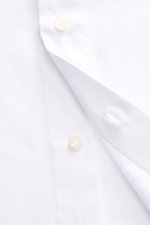Close-up front view of Borrelli Business Shirt 'Nando' Shark Collar white, showcasing fine cotton weave, mother-of-pearl buttons, and classic sport cuff. Masterful craftsmanship with slim fit, shark collar, French button placket, and rounded hemline. Pure