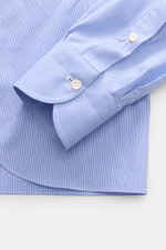 Close-up side view of Borrelli Business Shirt 'Nando' Shark Collar Blue/White Checkered cuff and hem, showcasing fine cotton poplin, slim fit, mother-of-pearl buttons, and classic sport cuff, embodying Neapolitan tailoring craftsmanship.