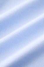 Close-up front view of Borrelli Business shirt 'Nando' shark collar light blue/white checked fabric, showing fine cotton poplin and check pattern. Masterful craftsmanship down to the smallest detail: The 'Nando' shirt by BORRELLI embodies Neapolitan tailo