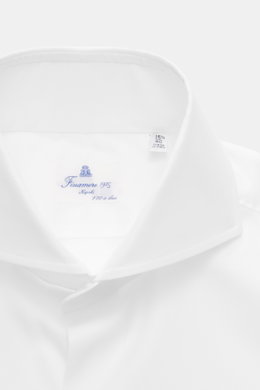 Close-up front view of the Finamore Business Shirt 'Sergio Napoli' Spread Collar white, crafted from pure Giza cotton with a smooth touch, regular fit, extra-long sleeves, French placket, classic sport cuff, and rounded hemline, showcasing confident style