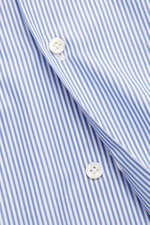Close-up front view of Finamore Business Shirt 'Sergio Napoli' Shark Collar blue/white striped, showcasing smooth pure Giza cotton fabric, French placket, and white buttons. Confident style at the office: The 'Sergio Napoli' shirt by FINAMORE impresses wi