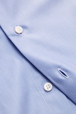 Close-up front view of the Fray Business Shirt Shark Collar 'Nello' light blue showing fine gabardine fabric, white buttons, and stitching details.