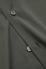 Close-up from above of the Fray Jersey Shirt Kent Collar 'Gabriel' Dark Green showing button, buttonhole, and fabric texture, pure cotton, soft touch, Slim Fit, Kent collar, classic sport cuff, back waist darts, extended back.