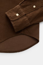Close-up image of the Polo Ralph Lauren Cord-Hemd Haifisch-Kragen braun, showing the cuff and hem from a top-down perspective. <p>Stilvoll durch die neue Saison: Mit diesem sportlichen Hemd von POLO RALPH LAUREN aus reinem Baumwoll-Cord mit Haifisch-Krage