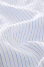 Close-up front detail of Polo Ralph Lauren Linen shirt button-down collar white/light blue striped, showing fabric texture and stripes.

<p>A summer classic from POLO RALPH LAUREN: This minimalist slim fit shirt in the finest linen with button-down collar
