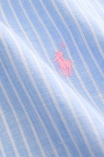 Close-up front view of Polo Ralph Lauren Linen shirt button-down collar light blue/white striped fabric with pink signature logo stitching, showing linen plain weave texture.

<p>A summer classic from POLO RALPH LAUREN: This minimalist slim fit shirt in t