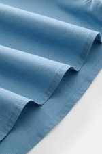 Alt tag (125 characters max):
Close-up side view of smoky blue fabric folds of 04651/ A trip in a bag Casual shirt 'Cloudy Shirt' slim collar, highlighting soft cotton.

Full description:
<p><span class="_fadeIn_m1hgl_8">Lightweight and comfortable for ho