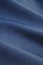 Close-up front view of Finamore Chambray shirt 'Sergio Gaeta' shark collar dark blue fabric, pure cotton chambray, very soft feel, slim fit, shark collar, French button placket with mother-of-pearl buttons, classic barrel cuffs, extra-long sleeves, contra