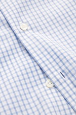 Close-up front view of the Giampaolo Casual shirt shark collar dark blue/white checkered, showing pure cotton fabric, soft touch, fine check pattern, slim fit, French button placket, classic sport cuff, and rounded hem.