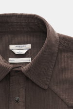 Close-up front view of Jacob Cohen Corduroy Shirt Narrow Collar Dark Brown showing narrow collar, applied snap button placket, corduroy made of pure cotton, soft touch, slim fit, shoulder and back yoke in western style, breast pockets with snap buttons, l