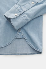 Ace Denim Denim shirt smoky blue shown from a close-up top-down view, highlighting pure cotton fabric, soft touch, slim fit, narrow collar, applied snap button placket, applied chest pockets, western-style yoke, classic sport cuff, and rounded hem.