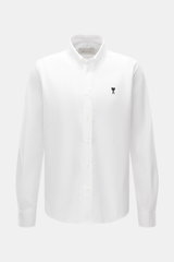 A front view of the Ami Paris Oxford Shirt Button-Down Collar White, classic modern interpretation, pure cotton with textured feel, regular fit, button placket, sport cuff, logo stitching, and rounded hemline.