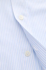 Close-up front view of Ami Paris Casual Shirt Button-Down Collar Light Blue/White Striped showing soft cotton fabric, classic stripe design, button placket.

<p>Modern interpretation of a classic: The casual shirt from AMI PARIS in classic stripe design b