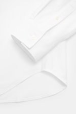 Maison Kitsuné Oxford shirt button-down collar white shown from a close-up top view of cuff and hem, pure cotton Oxford fabric, soft feel, regular fit, button-down collar, signature logo stitching, classic barrel cuffs, inverted pleat on the back, rounded