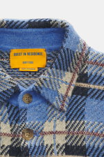 Close-up front view of Guest In Residence Cashmere knit shirt blue/navy/sand checkered showing pure cashmere, soft touch, medium-fine knit pattern, regular fit, smooth button placket, turn-down collar, breast pockets with flap and button, and short hem sl