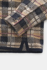 Close-up front view of the Guest In Residence Cashmere knit shirt light brown/beige/navy checkered showing pure cashmere, soft feel, medium-fine knit pattern, regular fit, smooth button placket, turn-down collar, breast pockets with flap and button, and s