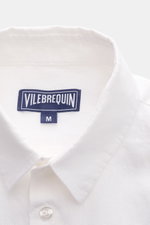 Close-up front top view of the Vilebrequin Linen shirt slim collar white, showcasing lightweight fabric, soft feel, regular fit, narrow collar, French button placket, classic barrel cuffs, patch breast pocket, rounded hem, and tonal stitching on the hem.