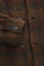 Close-up front view of the Barena Venezia Overshirt brown/grey checkered showing buttoned sleeve cuffs, patch chest pocket, four-button placket, pure virgin wool with a slightly textured feel, Regular Fit, turn-down collar, unconstructed design, and one i