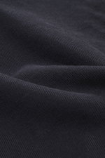 Close-up front view of navy corduroy fabric showcasing texture of Officine Générale Corduroy shirt kent collar navy, corduroy made of pure cotton, soft touch, regular fit, kent collar, French button placket, classic sport cuff, short hem slits.