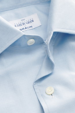 Close-up front view of the Gherardi Casual shirt shark collar light blue, showing twill made of cotton and cashmere, soft flannel, slim fit, shark collar, french button placket, classic sport cuff, split back yoke, rear waist darts, and rounded hemline.
