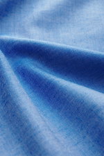 Close-up front angle of Gherardi Casual shirt shark collar blue melange fabric showing twill made of cotton and cashmere, soft flannel texture, slim fit, shark collar, french button placket, classic sport cuff, split back yoke, rear waist darts, and round