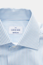 Close-up front view of Gherardi Casual shirt kent collar light blue/white striped, pure cotton, very soft touch, slim fit, kent collar, French button placket, classic sport cuff, split back yoke, back waist darts, rounded hem.