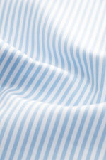Close-up front view of fabric detail of Gherardi Casual shirt kent collar light blue/white striped, pure cotton, very soft touch, slim fit, kent collar, French button placket, classic sport cuff, split back yoke, back waist darts, rounded hem.