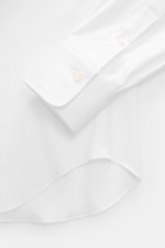 White Gherardi Casual shirt shark collar white shown from above, featuring elastic cotton, soft touch, lightweight quality, slim fit, shark collar, French placket, classic sport cuff, back waist darts, and rounded hem.