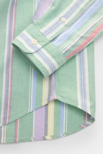 Close-up view of the Polo Ralph Lauren Oxford shirt button-down collar green/multicolour striped showing the cuff and rounded hem with colourful stripes.

<p>A modern take on the classic Oxford shirt: POLO RALPH LAUREN has added colourful stripes to the e