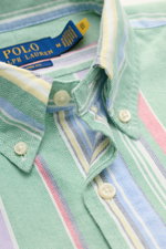 Close-up front view of Polo Ralph Lauren Oxford shirt button-down collar green/multicolour striped with colorful stripes and button details.

<p>A modern take on the classic Oxford shirt: POLO RALPH LAUREN has added colourful stripes to the essential piec